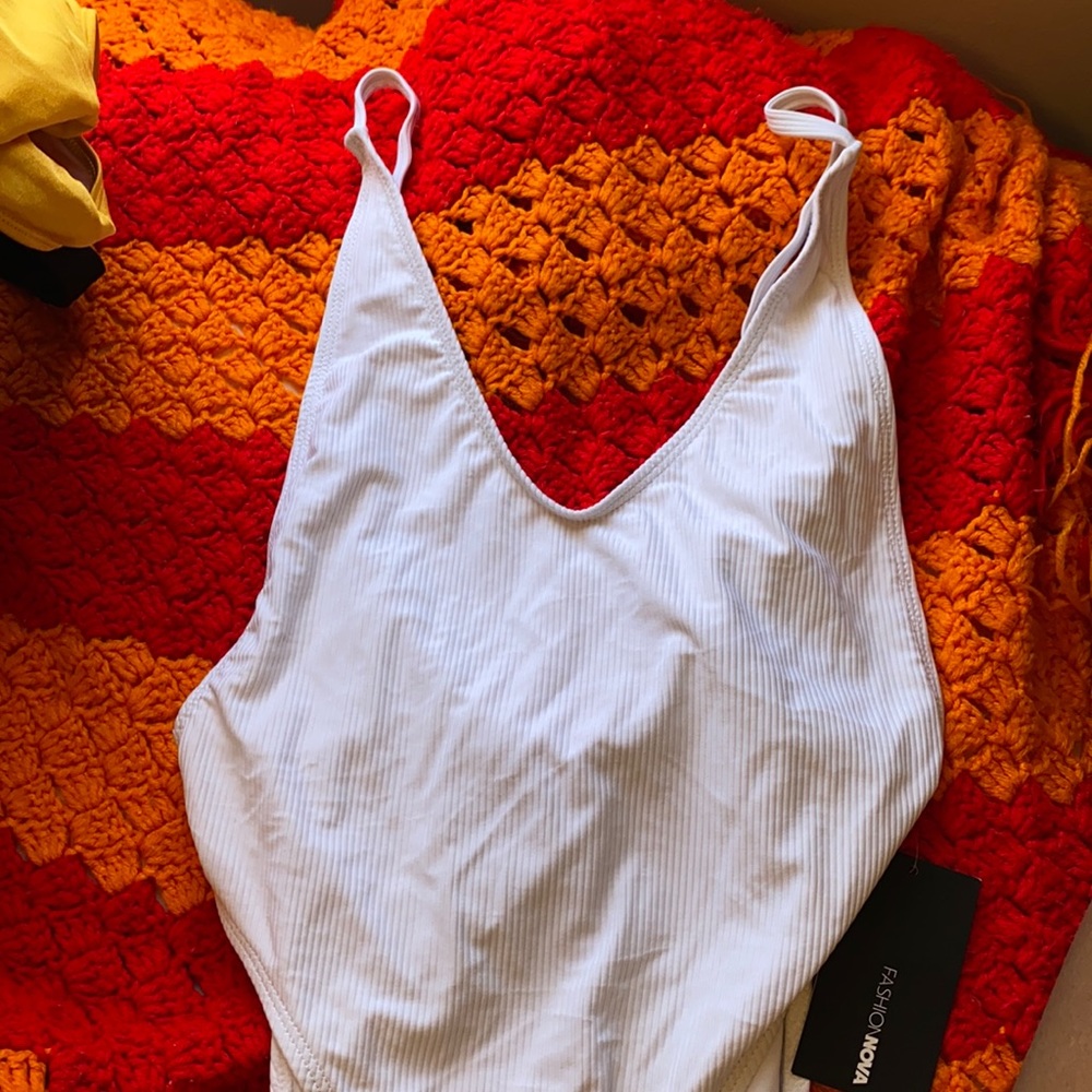White open back , slit sides swimsuit.